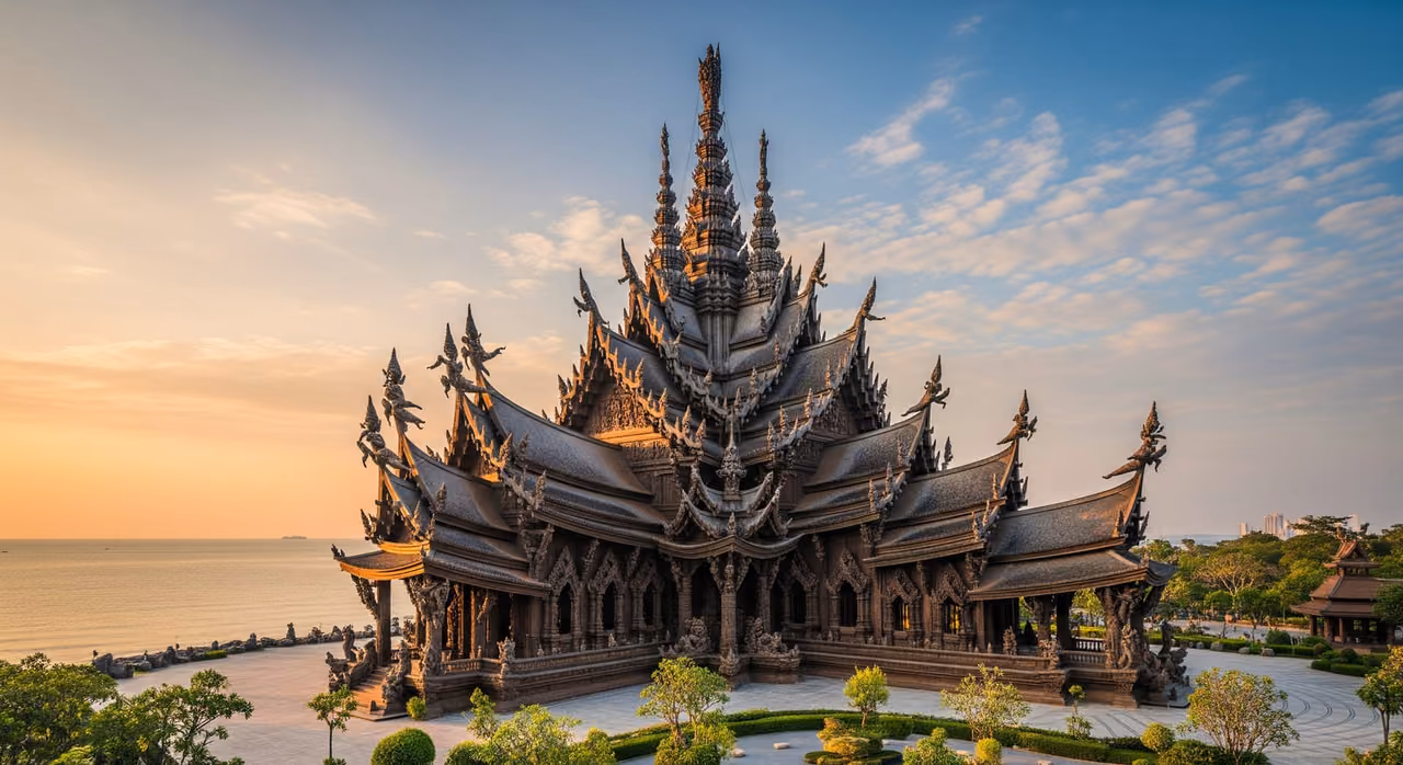 The intricately carved all-wooden Sanctuary of Truth temple rising above the coastline in Pattaya